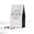 Coffee bag with 'Pensive Man's Coffee' branding on a white background